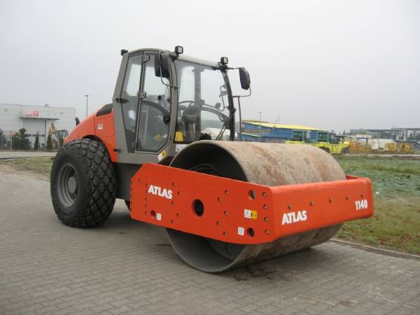 How do roller compactors operate?